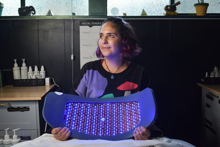 Ashley, founder of SlickChart and Botanical Aesthetics, in her treatment room